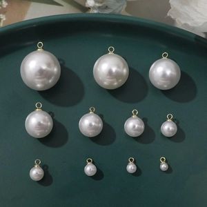 Detailed size range of white faux pearl pendants with gold loops for DIY jewelry making