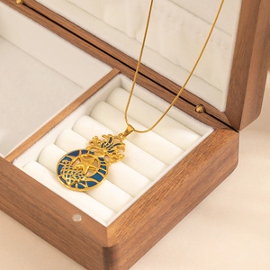 Golden stainless steel necklace with blue enamel star pendant and thin snake chain