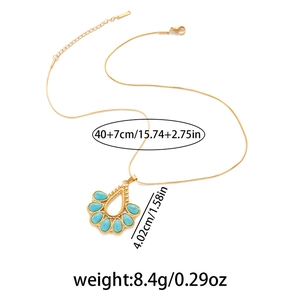 Detailed view of bohemian gold necklace with turquoise stones and size measurements