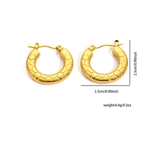 Detail view of 18K gold-plated wide hoop earrings with geometric honeycomb texture and size