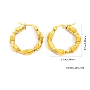 Detail view of gold bamboo texture hoop earrings with size dimensions and weight info
