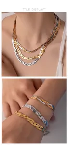 Detailed view of tricolor braided herringbone chain necklace and bracelet on model