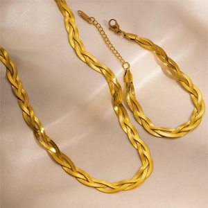 Detail of gold-plated braided chain set including necklace and bracelet with lobster clasp