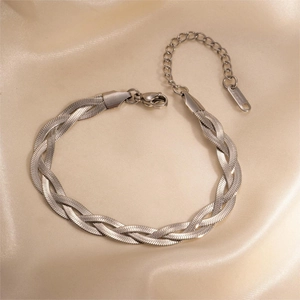 Detail of silver twisted herringbone chain bracelet with lobster clasp and extender