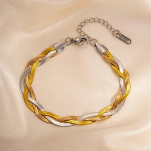 Macro detail of tricolor braided herringbone chain bracelet with S.STEEL stamp
