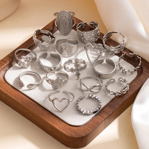 Detailed flat lay of 15 pieces adjustable silver ring set with diverse geometric patterns