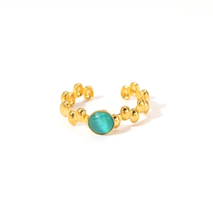 Macro view of adjustable 18K gold plated ring with beaded texture and turquoise stone