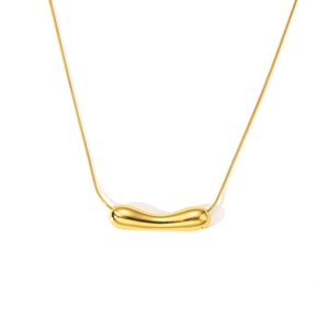 Detailed close-up of a polished gold organic bean pendant on a sleek snake chain necklace
