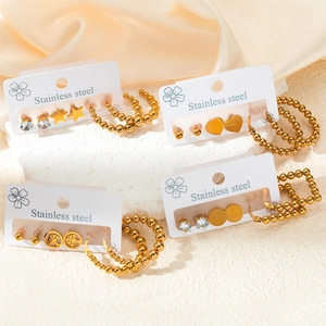 Set de boucles d'oreilles dorées en acier inoxydable avec charmes étoile et coeur