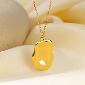 Detailed macro view of 18K gold irregular lava pendant necklace with organic flow texture