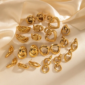 Collection of vintage gold-plated titanium steel hoop earrings and heart jewelry studs