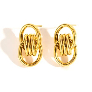 Detailed view of 18k gold plated stainless steel layered hoop earrings with a woven design