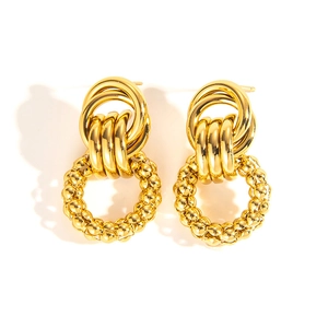 Detail of vintage 18k gold plated stainless steel drop earrings with textured woven hoops