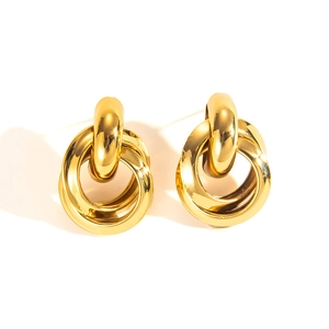Detail of twisted multi-hoop 18k gold plated stainless steel earrings with polished finish