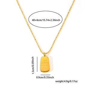 Detail of gold titanium tag necklace engraved with I love you to the moon and back
