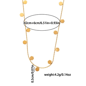 Detailed view of golden butterfly necklace with 42cm length and hexagon charm specs