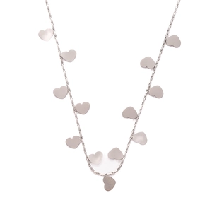 Macro view of minimalist silver multi-heart pendant necklace with polished finish