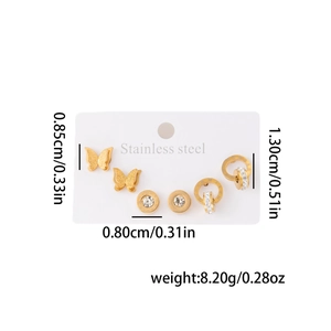 Trois paires de boucles d'oreilles en acier doré avec papillon et zircons