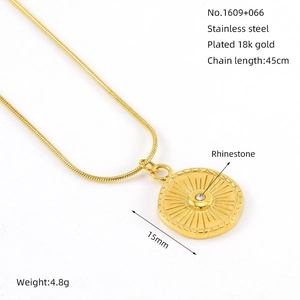 Minimalist 18K gold plated stainless steel necklace with starburst sun medallion