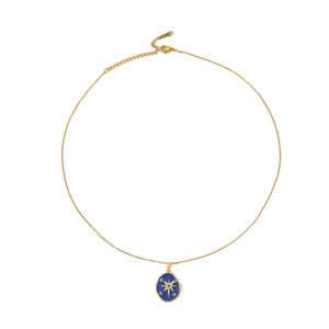 Detailed macro of golden starburst necklace with blue enamel pendant and lobster clasp