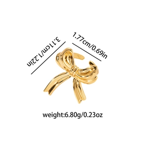 Golden bow ribbon ear cuff accessory with polished finish shown with size dimensions