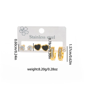 Three-pair stainless steel earring set with heart studs, zircon studs, and gold huggie hoops