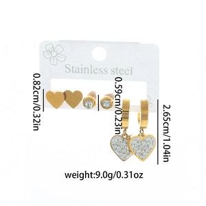 Three-piece golden stainless steel earring set with heart motifs and sparkling zircons