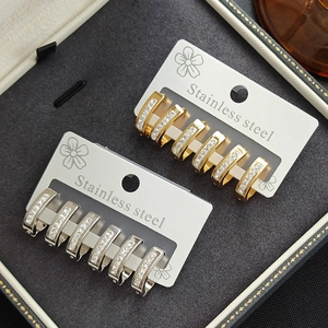 U-shaped stainless steel hoop earrings with crystal pave settings in gold and silver colors