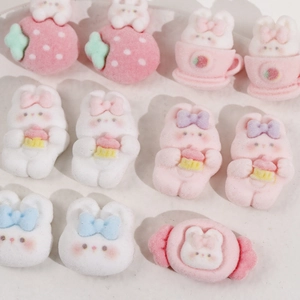 Detailed view of assorted flocked resin bunny charms for DIY hair clip accessories