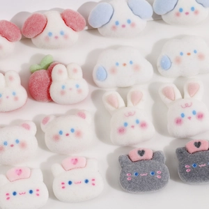 Detailed view of cute white flocked DIY patches featuring cartoon animals and clouds