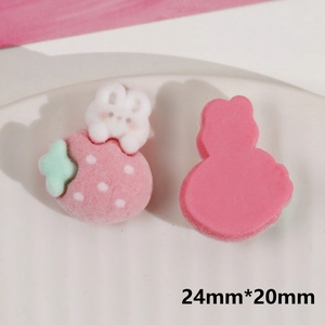 Close-up of pink flocked strawberry bunny DIY charms showing front and flat back details