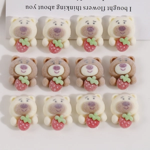 Detail view of 12 DIY resin bear charms in cream and brown with flocked texture