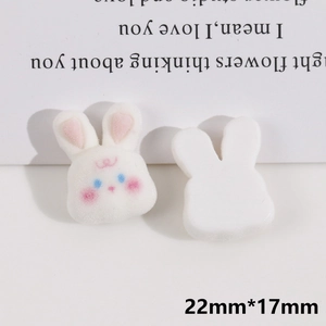 Detail of white flocked rabbit charms with dimensions 22mm by 17mm for DIY jewelry