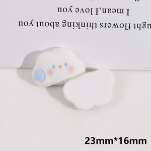 Macro view of white cloud resin charms with cute facial details and 23x16mm dimensions