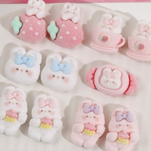 Collection of flocked cartoon bunny resin charms with strawberry and cupcake designs