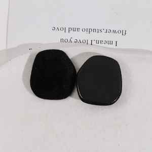 Macro detail of black trapezoid plush sponge pads with functional plastic base
