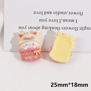 Macro view of rabbit resin flatback charm with lion hat and fortune bag for DIY crafts
