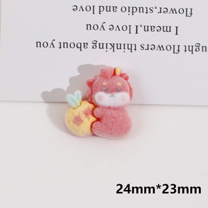 Detail of pink flocked dragon DIY accessory with lucky ball, size 24mm by 23mm