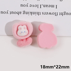 Macro detail of pink flocked rabbit DIY accessory showing front and back views with dimensions