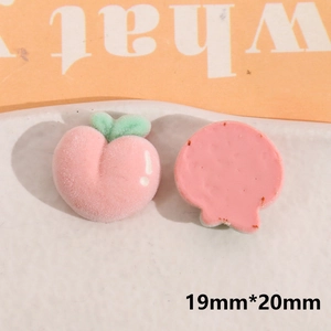 Macro detail of flocked peach resin charm for DIY hair clips and phone case decor