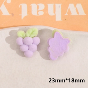 Detailed view of flocked purple grape resin charms for DIY crafts and hair accessories