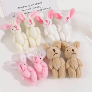 Macro shot of colorful plush bunny keychains with long ears and soft faux fur texture
