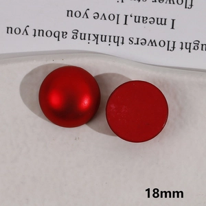 Detail of 18mm red matte round acrylic charms with a flat back for DIY hair accessories