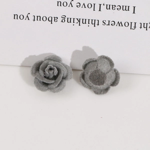 Macro shot of grey flocked rose DIY jewelry accessory showing fine velvet texture