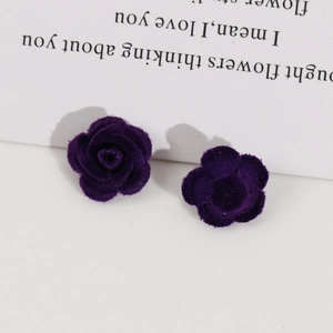 Detailed close-up of dark purple flocked rose flower patches for DIY hair accessories