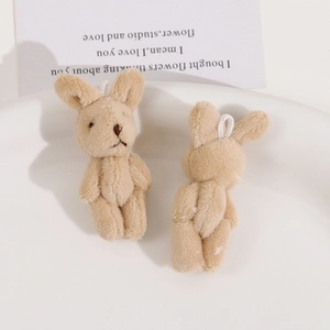 Detailed front and back view of light brown plush rabbit pendant with soft white loop