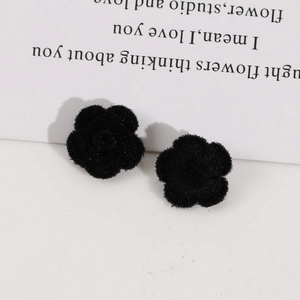 Detailed close-up of sweet black flocked rose flower patches for DIY hair accessories