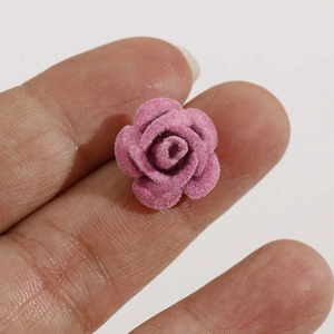Macro shot of hot pink flocked rose charm for DIY jewelry and hair accessory making