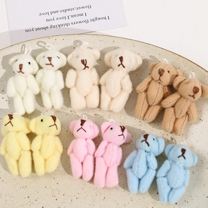 Macro shot of colorful mini plush bears in a ceramic tray for DIY accessory making