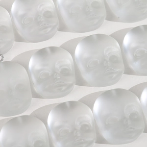 Translucent matte resin baby head charm with relief design for DIY jewelry and crafts